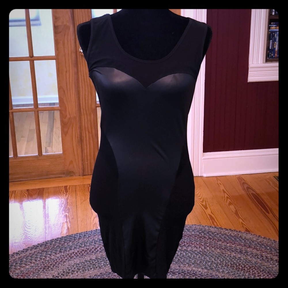 Symphony Little black form fitting dress.